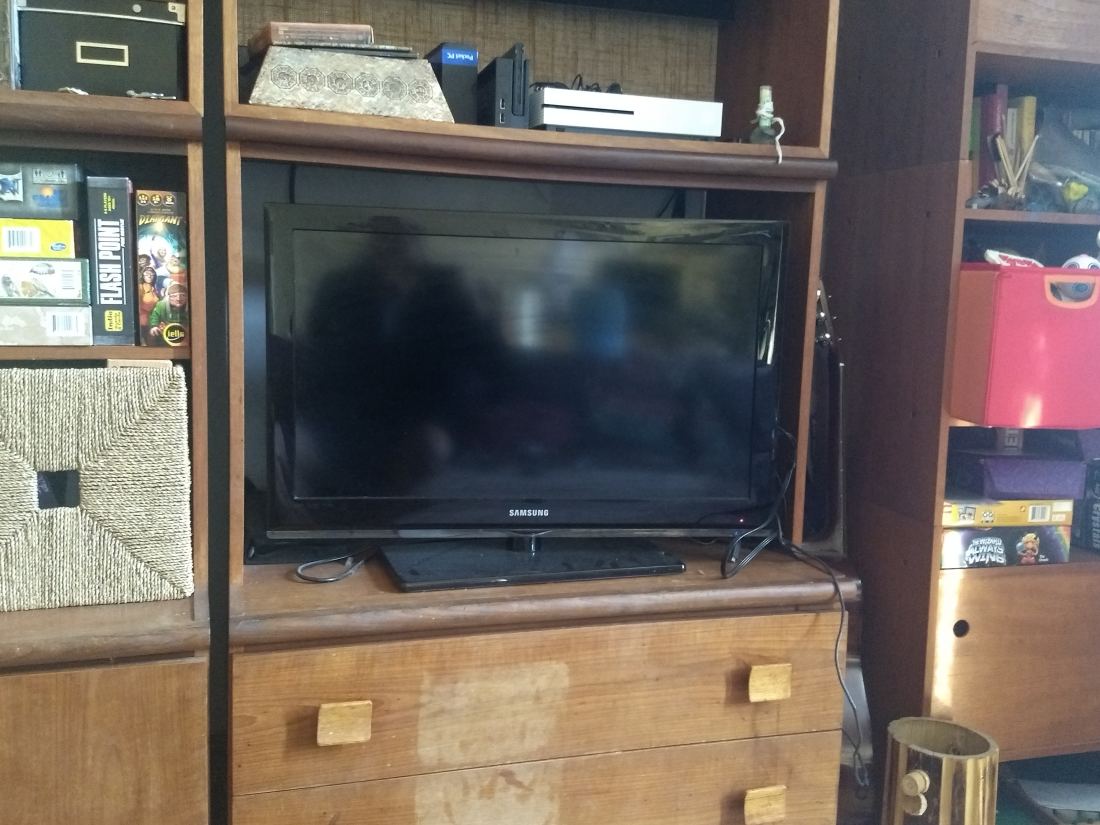 A flat-screen television on a media unit